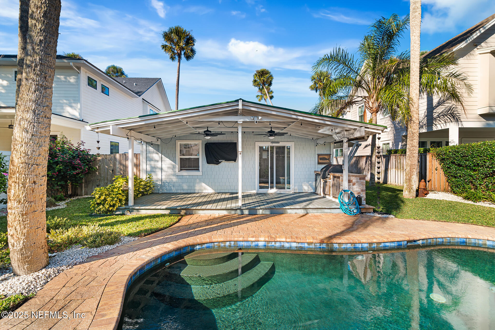 370 10th Street Atlantic Beach, FL 32233 - Photo 22 of 24 a view of a house with backyard and sitting area