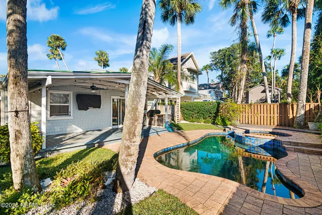 a view of a swimming pool with a patio