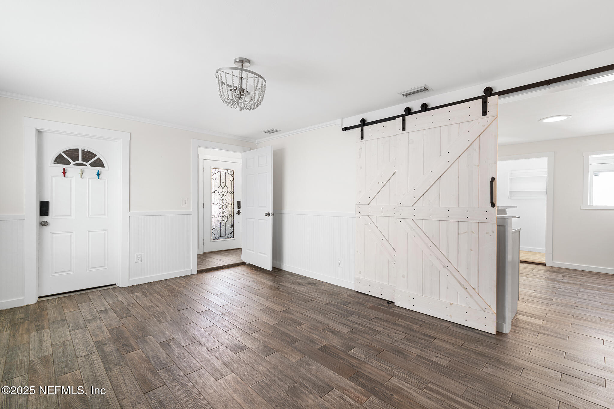 370 10th Street Atlantic Beach, FL 32233 - Photo 8 of 24 a view of an entryway with wooden floor