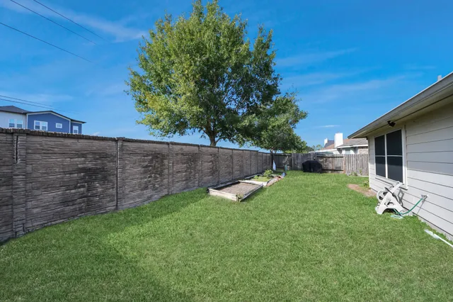 a view of a backyard with a garden
