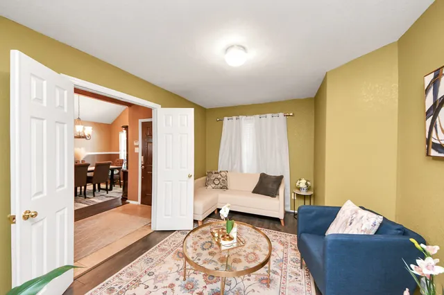 a living room with furniture and a table