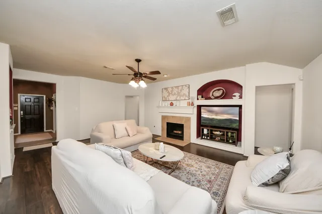a bedroom with a bed and a fireplace