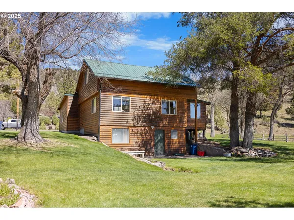 a backyard of a house with lots of green space