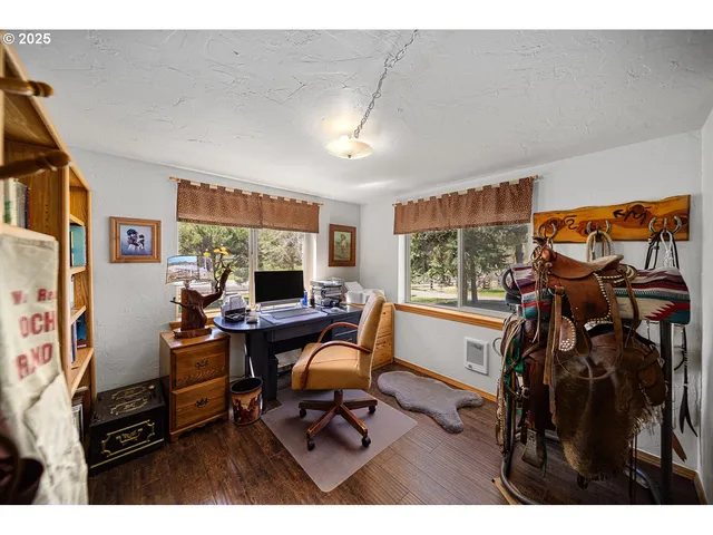 a work room with furniture and a window