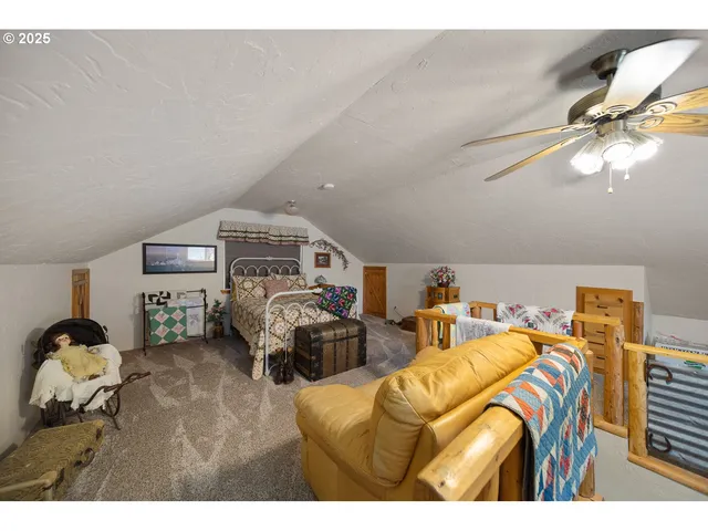 a bedroom with furniture and a chandelier
