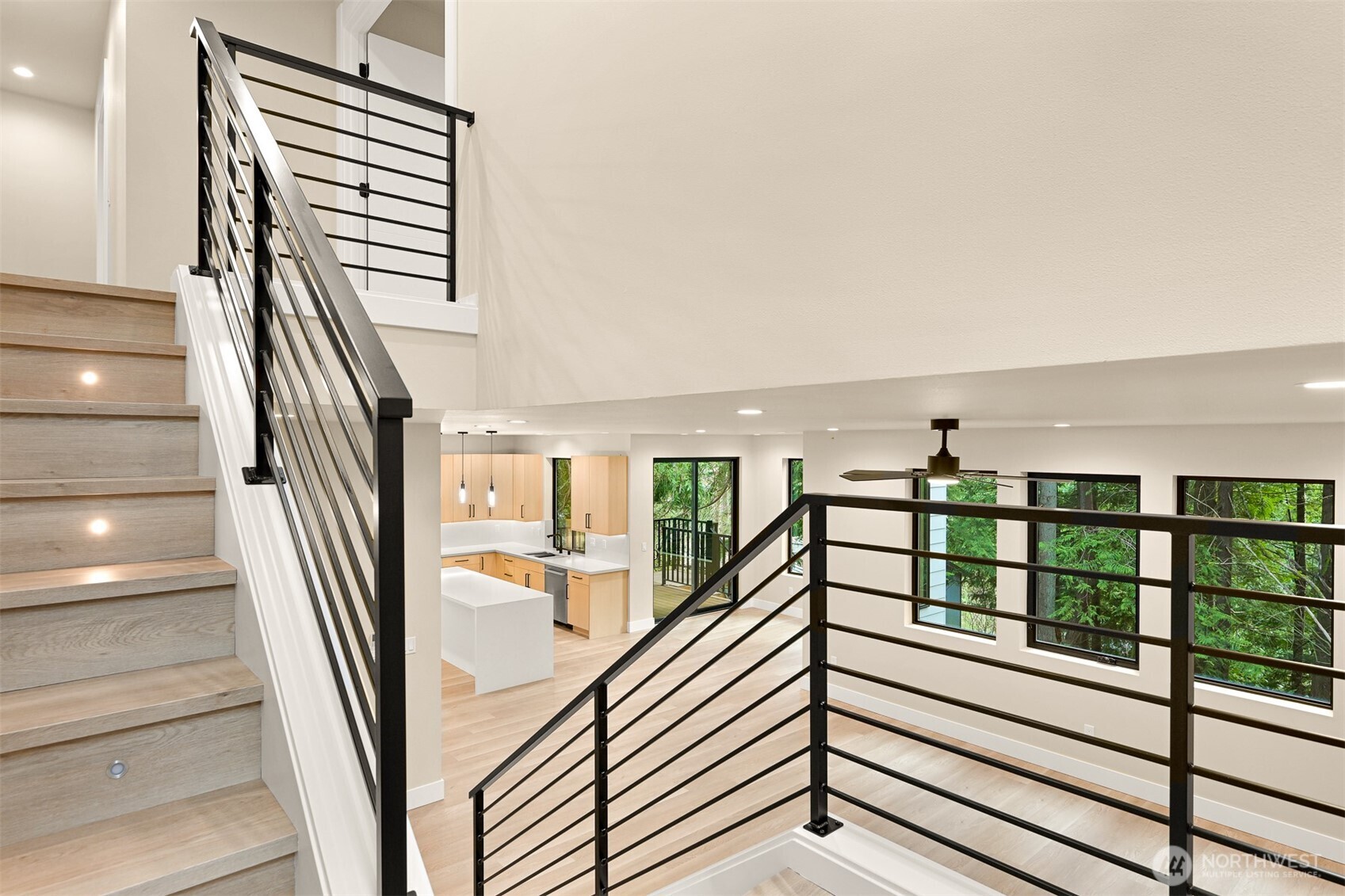 353 Sudden Valley Drive Bellingham, WA 98229 - Photo 21 of 40 a view of staircase with lots of frames on wall