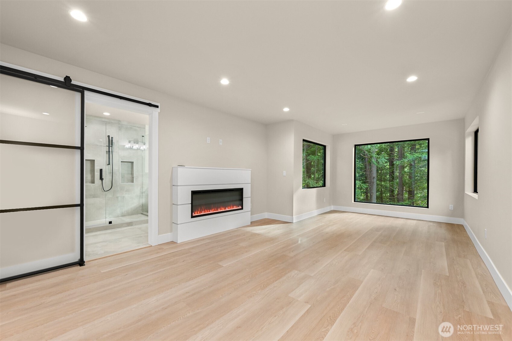 353 Sudden Valley Drive Bellingham, WA 98229 - Photo 22 of 40 a view of an empty room with a fireplace and a window
