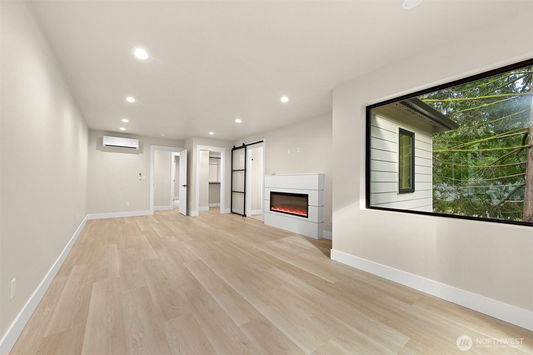 353 Sudden Valley Drive Bellingham, WA 98229 - Photo 23 of 40 a view of an empty room with a fireplace and a window