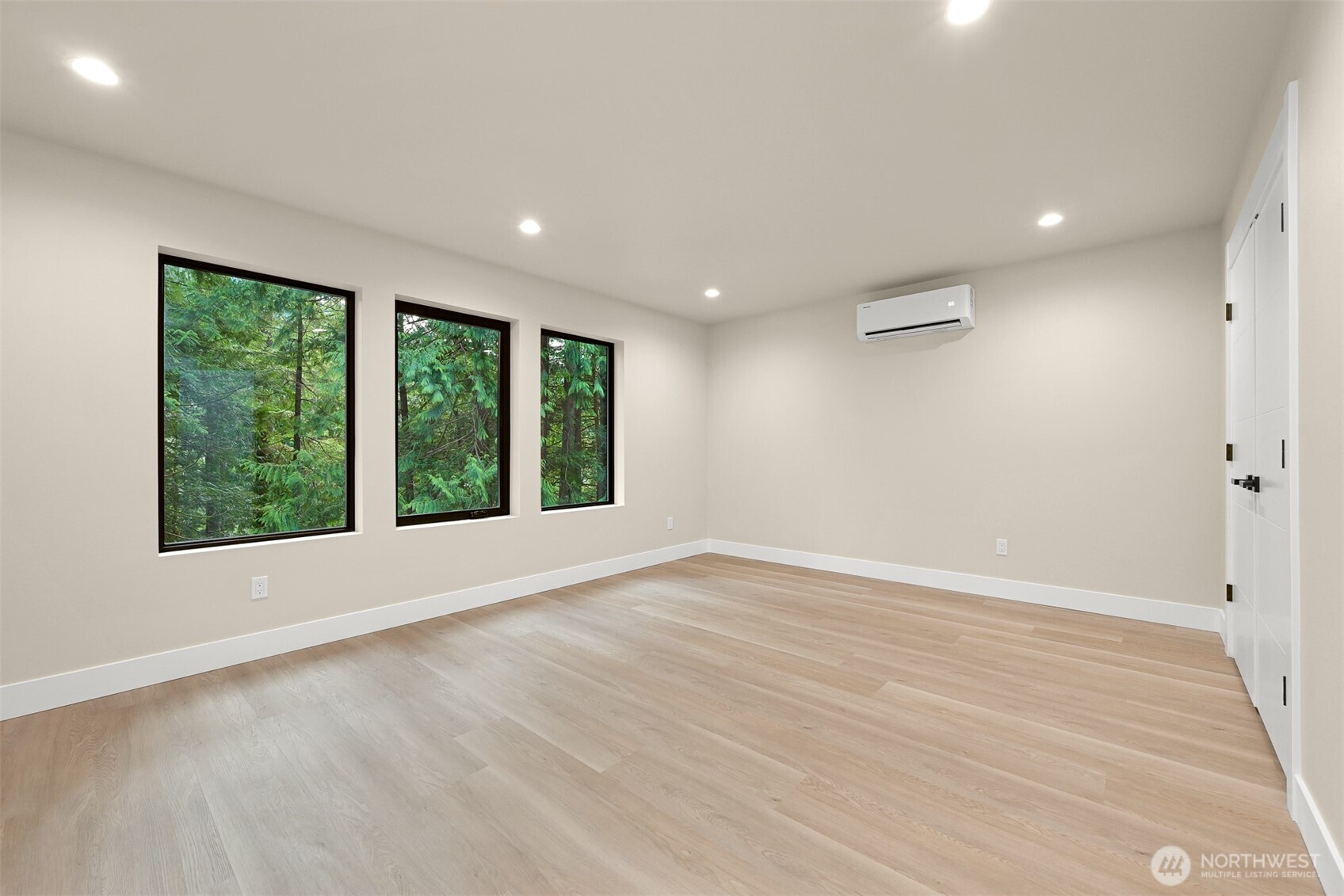 353 Sudden Valley Drive Bellingham, WA 98229 - Photo 29 of 40 a view of an empty room with wooden floor and a window