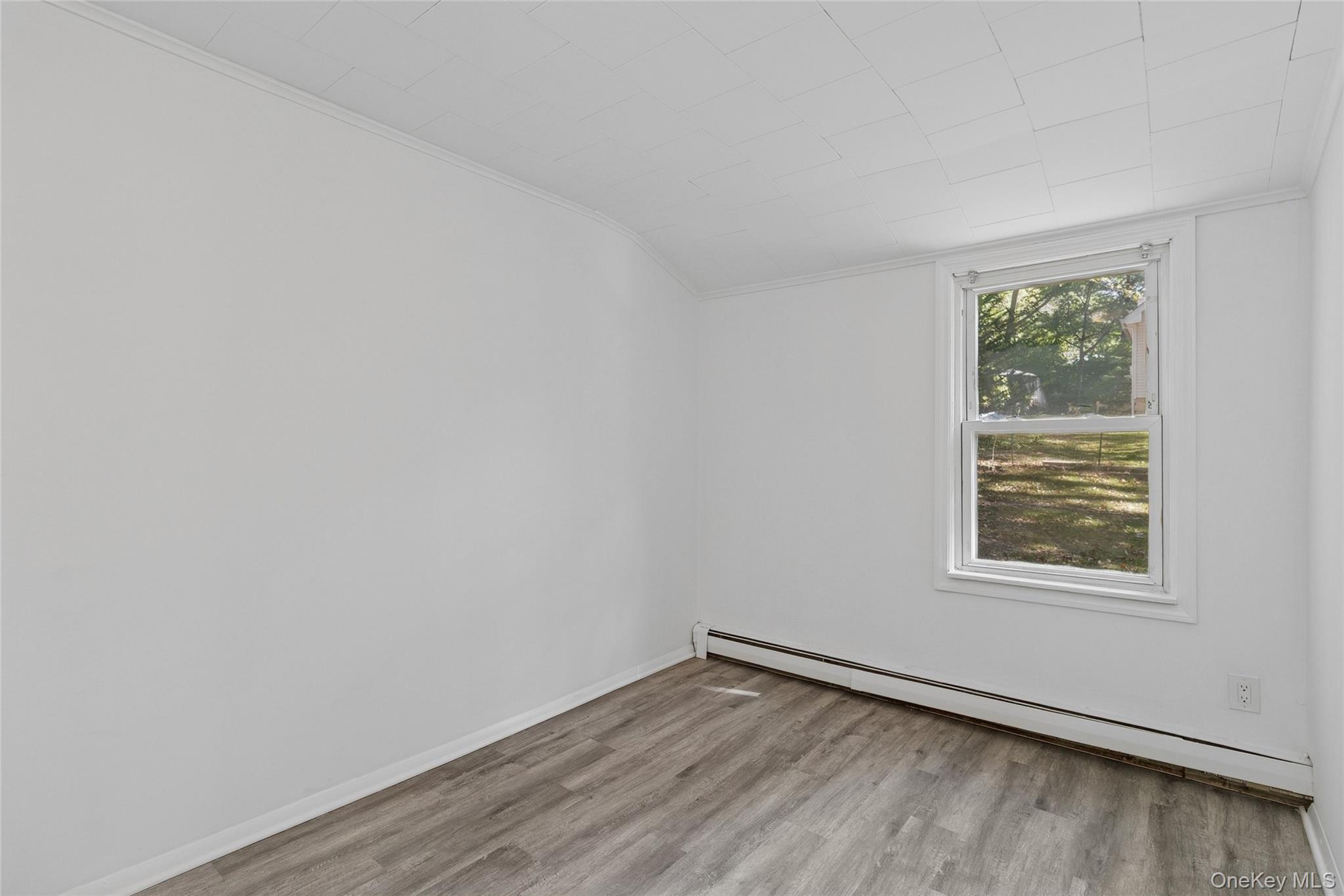 7 Yucca Road Rocky Point, NY 11778 - Photo 12 of 22 an empty room with a window