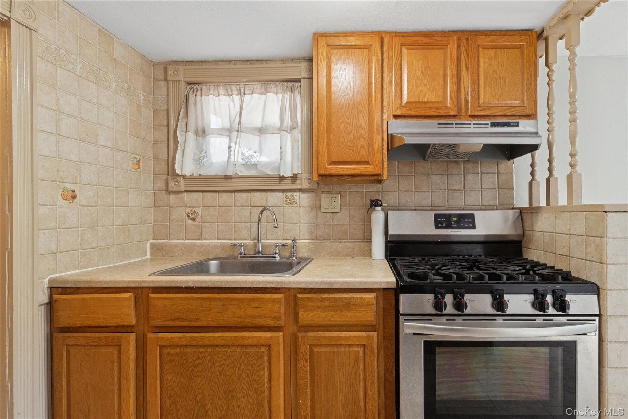 7 Yucca Road Rocky Point, NY 11778 - Photo 17 of 22 a kitchen with granite countertop a sink stainless steel appliances and cabinets
