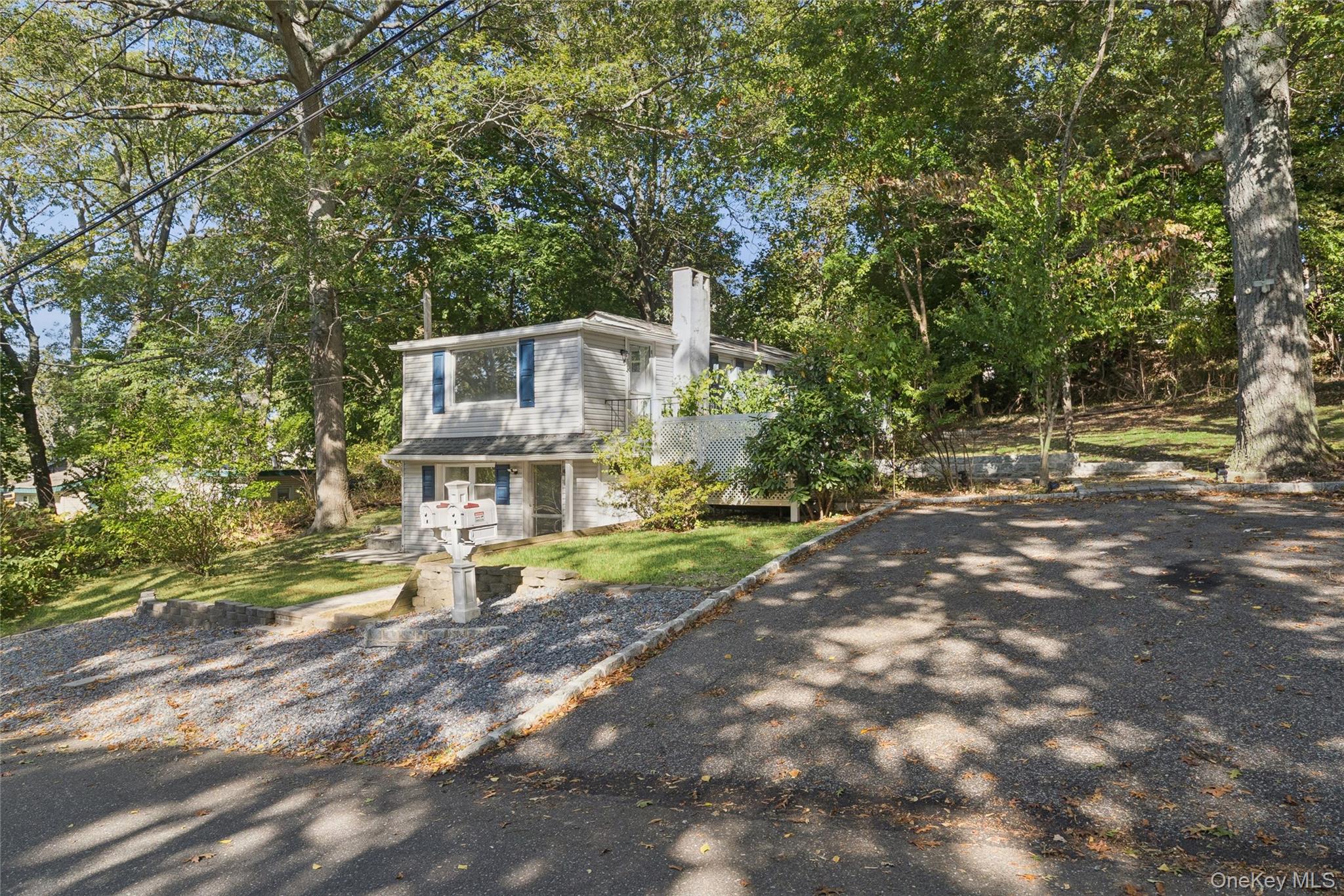 7 Yucca Road Rocky Point, NY 11778 - Photo 2 of 22 a view of a house with a yard