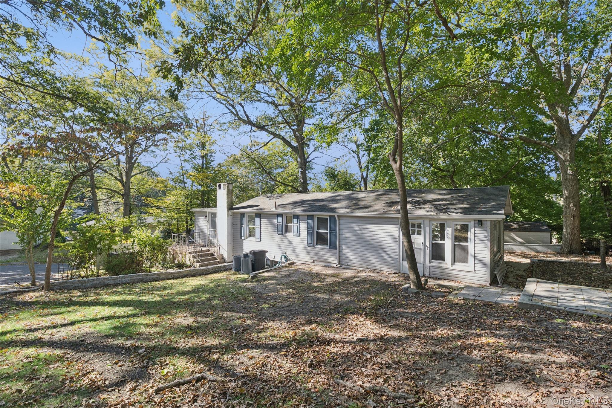 7 Yucca Road Rocky Point, NY 11778 - Photo 3 of 22 a view of a house with a yard