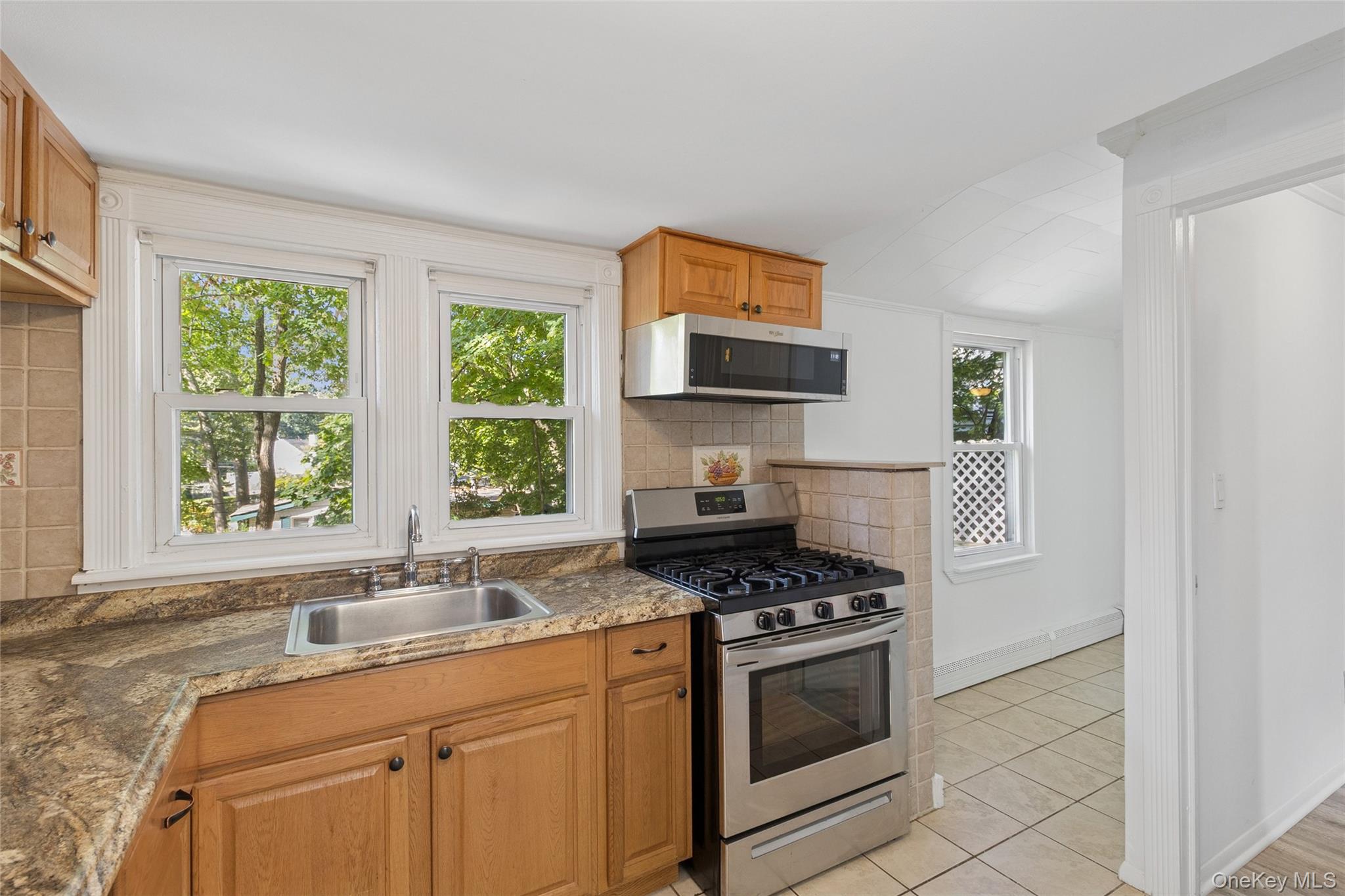 7 Yucca Road Rocky Point, NY 11778 - Photo 7 of 22 a kitchen with stainless steel appliances a sink stove and window