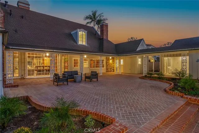 a front view of house with yard and outdoor seating