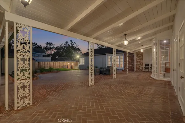 a living room with furniture flat screen tv and a fireplace