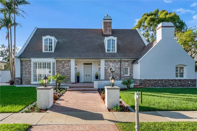a view of a livingroom with furniture and floor to ceiling window