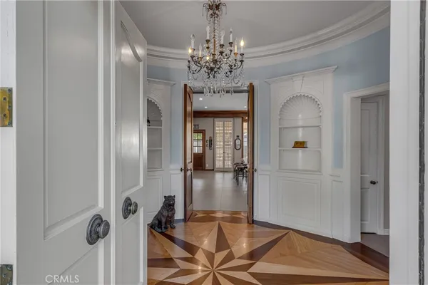 a room with pool table a flat screen tv and a fireplace