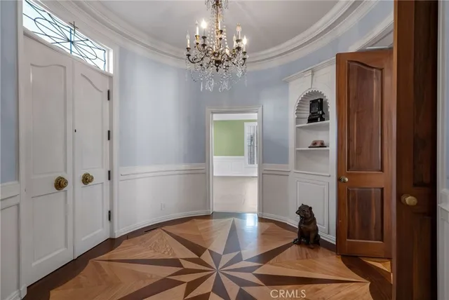 a living room with fireplace and a wooden floor