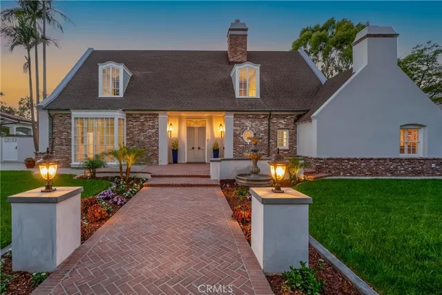 a view of a patio with table and chairs potted plants