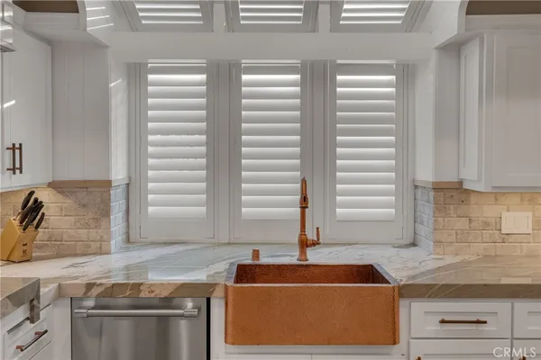 a bathroom with a sink and a large mirror