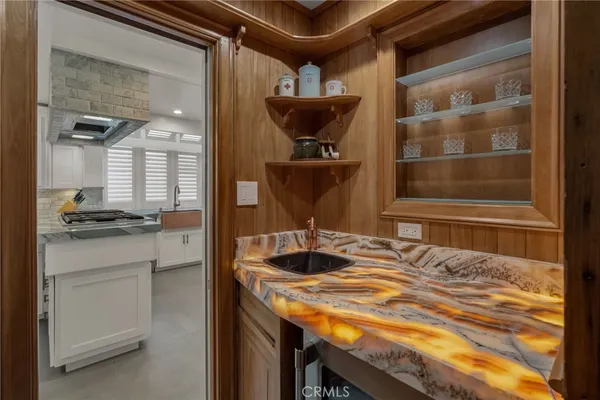 a bathroom with a tub sink and mirror