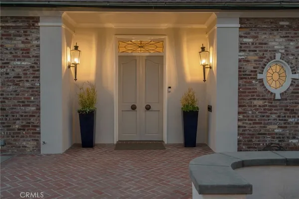 a view of a entryway door with wooden floor