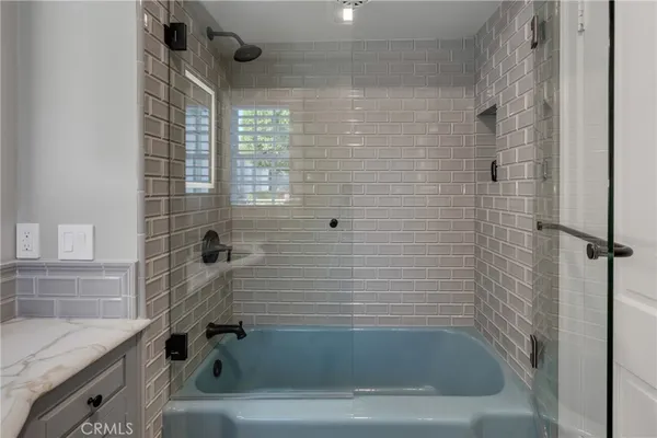 a front view of house with a garden