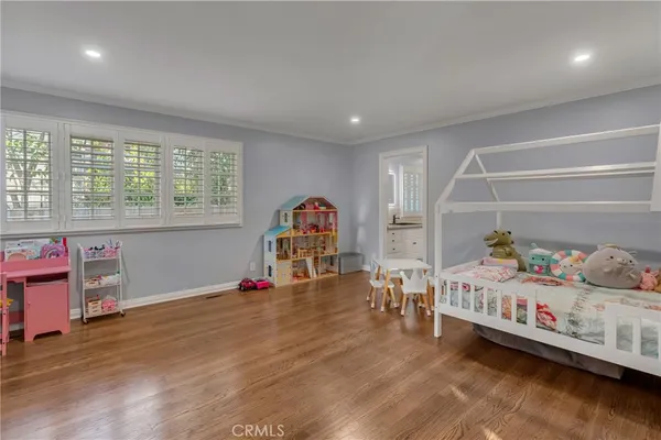 a bathroom with a shower sink vanity and toilet