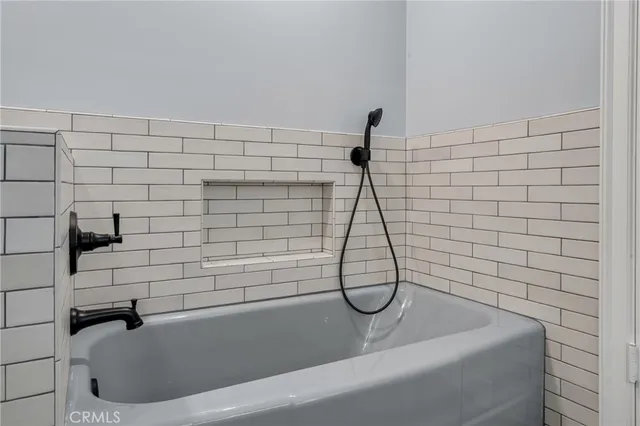 an aerial view of a house with garden space and street view