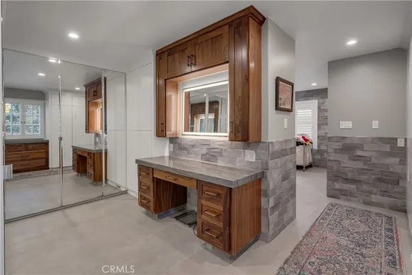 an aerial view of a house with a yard swimming pool and outdoor seating