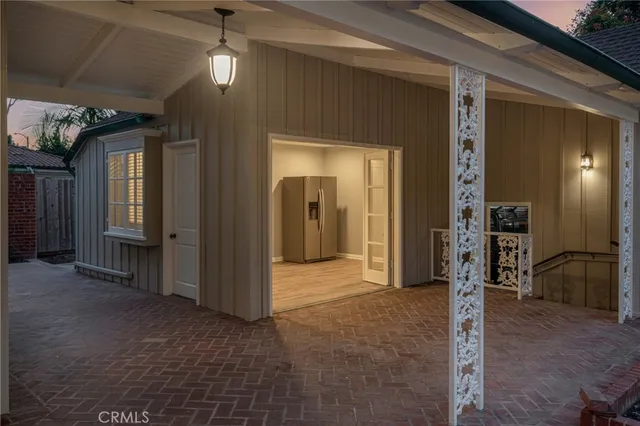 a view of hallway with livingroom and chandelier