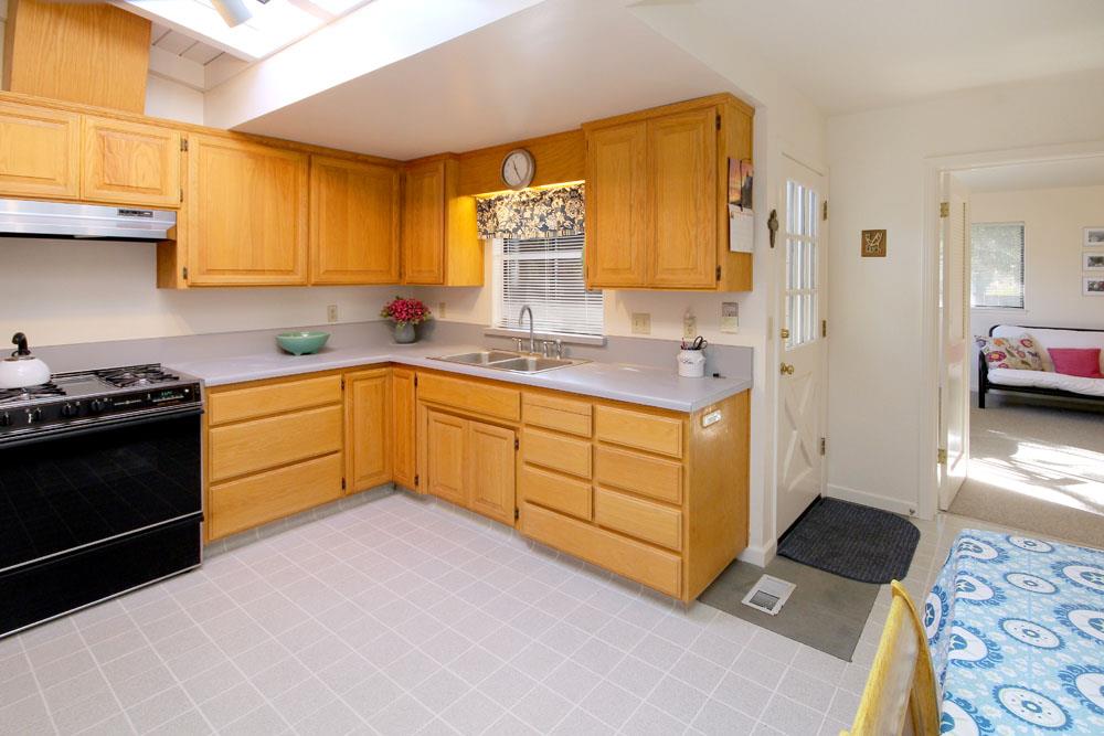611 Middlefield Drive Aptos, CA 95003 - Photo 5 of 11 a kitchen with a sink stove and cabinets