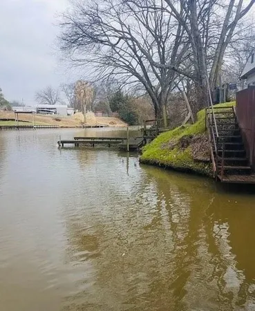 a view of a lake with boats and trees