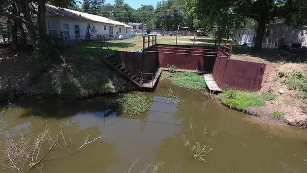 a view of backyard with outdoor seating and green space