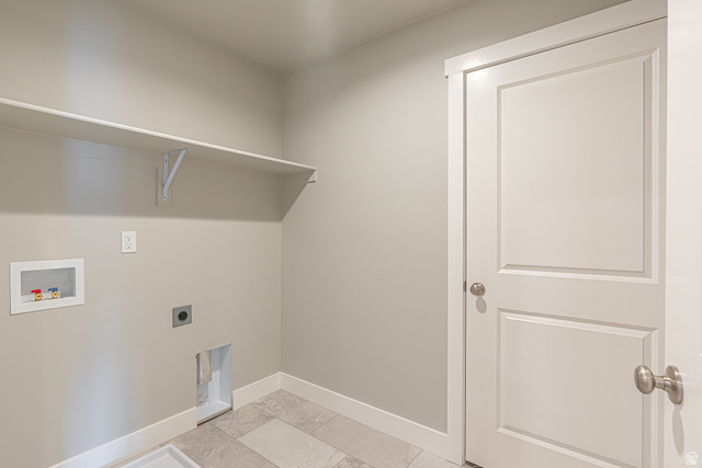 2257 South 1090 West, Unit 74 Nibley, UT 84321 - Photo 14 of 40 Dedicated utility space featuring a built-in shelving unit, neutral wall paint, and tile flooring