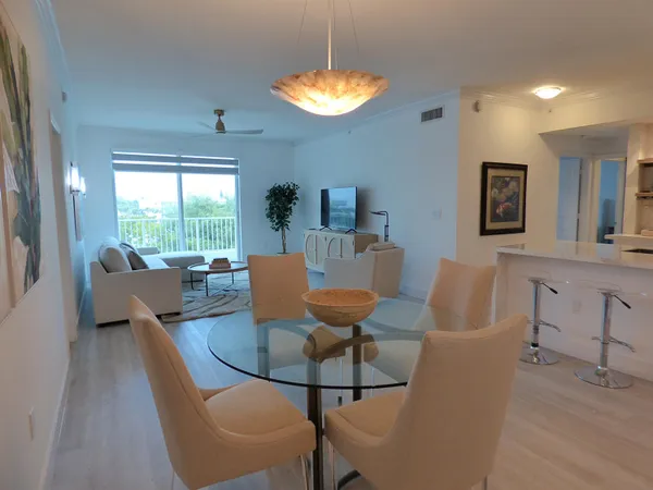 a view of a dining room with furniture window and outside view