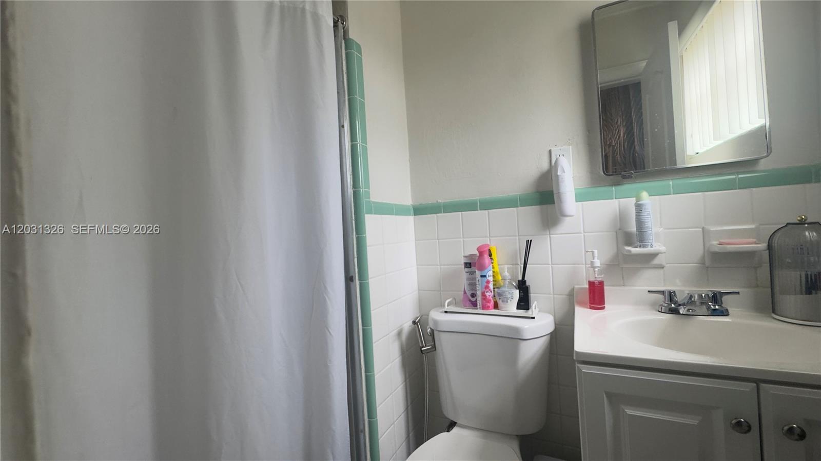 12480 Southwest 189th Street Miami, FL 33177 - Photo 15 of 25 a bathroom with a sink and a toilet