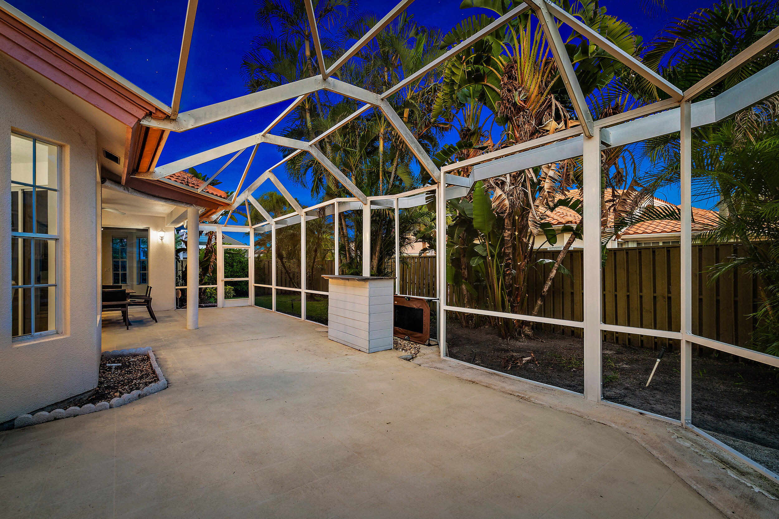 207 Eagleton Estates Boulevard Palm Beach Gardens, FL 33418 - Photo 26 of 33 a view of an chairs with table in front of a house