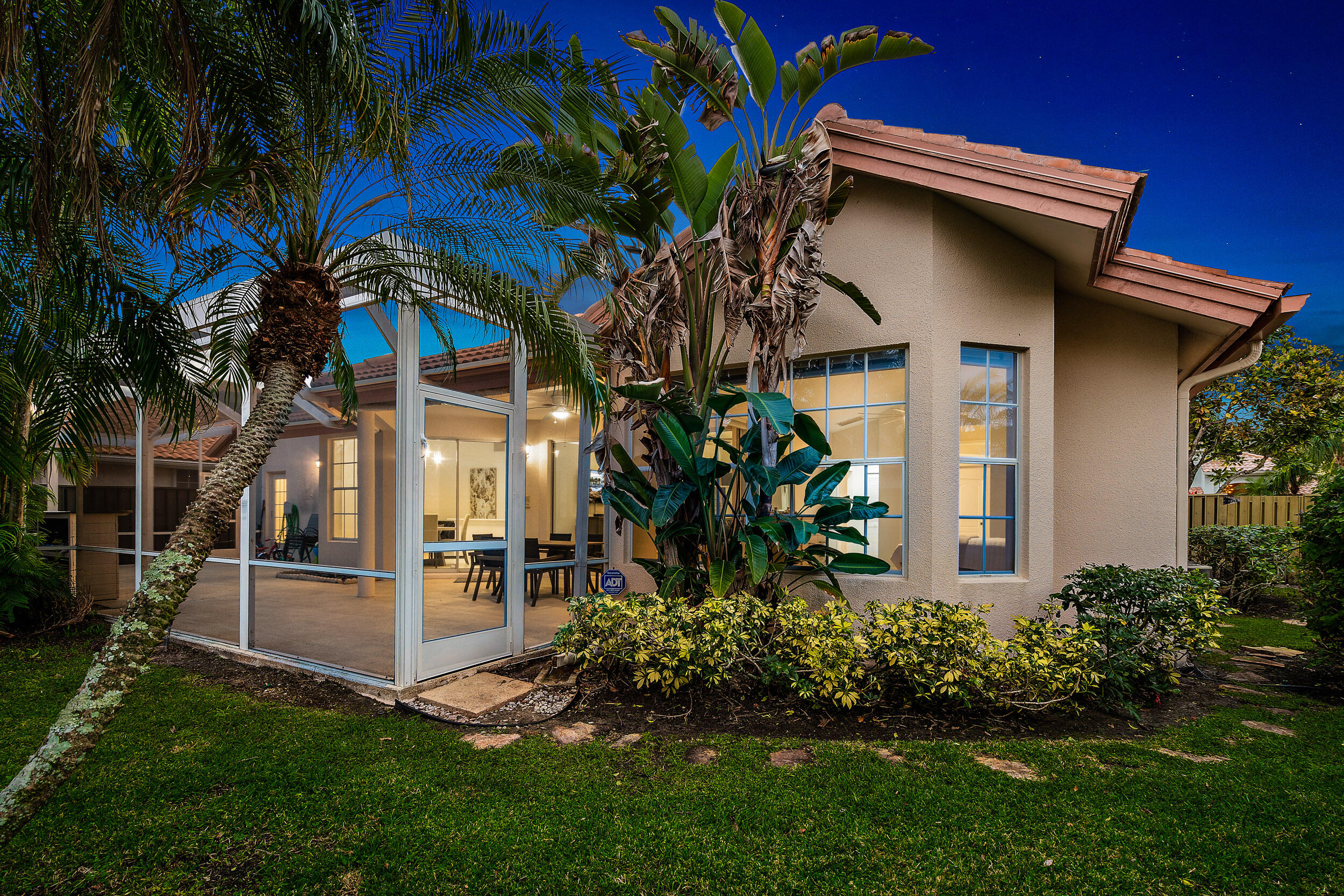 207 Eagleton Estates Boulevard Palm Beach Gardens, FL 33418 - Photo 31 of 33 a view of a house with a yard and plants