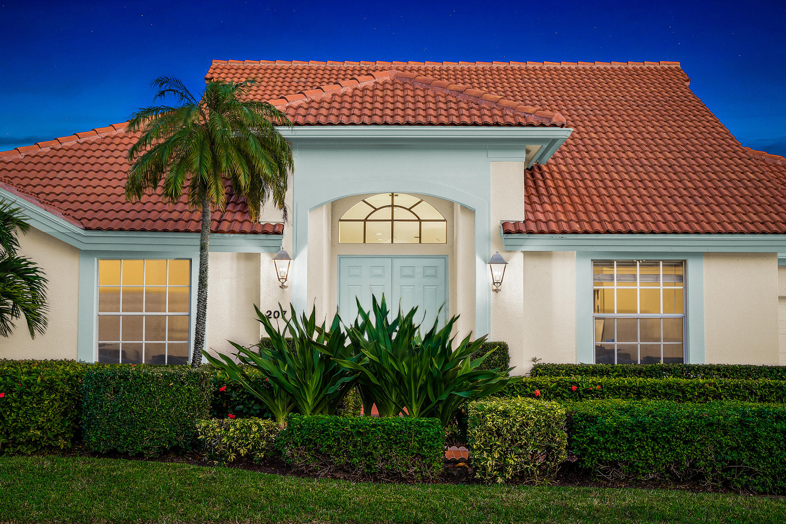 207 Eagleton Estates Boulevard Palm Beach Gardens, FL 33418 - Photo 33 of 33 a front view of a house with garden
