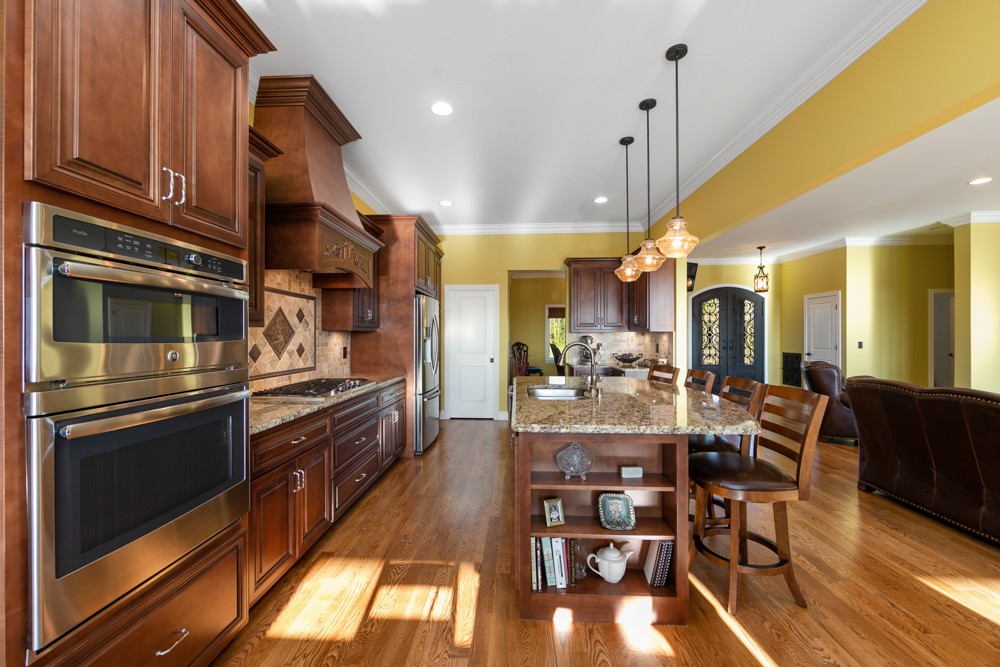 1895 French Brantley Road Wartrace, TN 37183 - Photo 26 of 50 a kitchen with stainless steel appliances kitchen island granite countertop a table chairs and a refrigerator