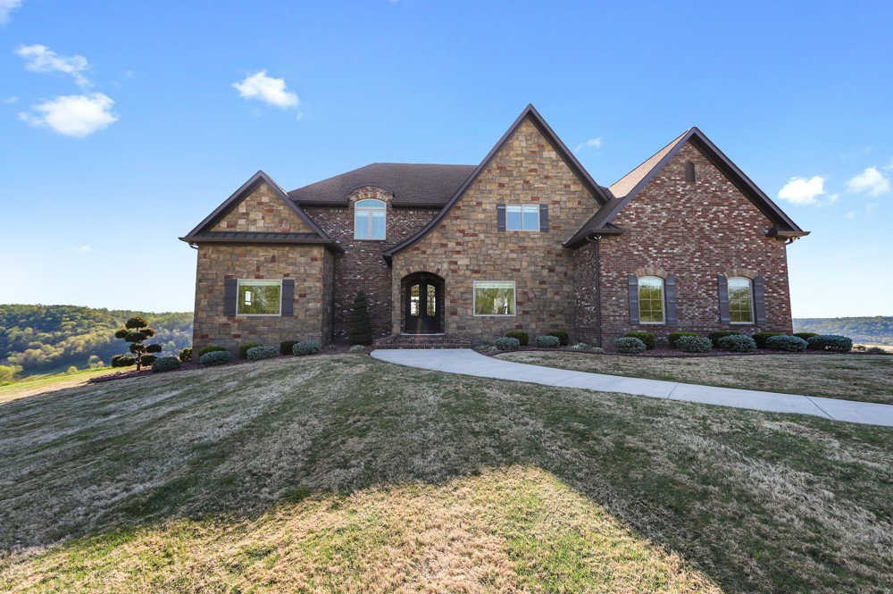 1895 French Brantley Road Wartrace, TN 37183 - Photo 4 of 50 a front view of a house with a yard and garage