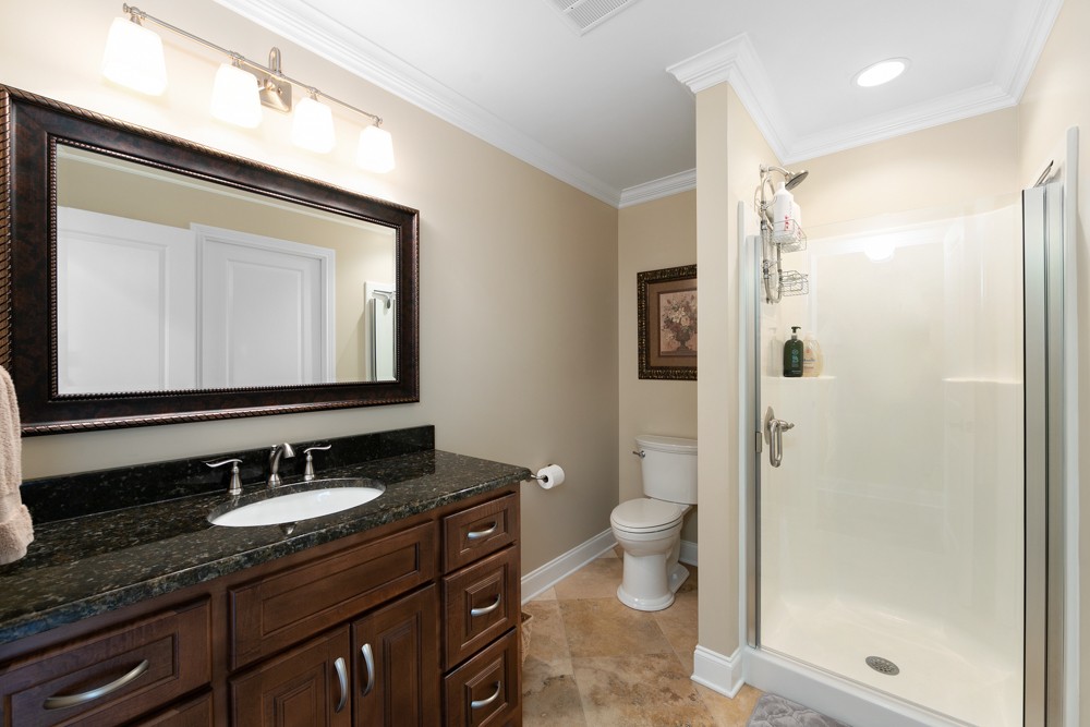 1895 French Brantley Road Wartrace, TN 37183 - Photo 49 of 50 a bathroom with a granite countertop sink toilet a mirror and shower