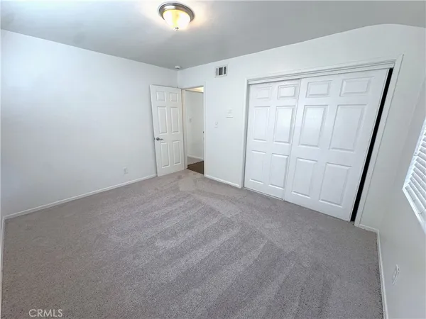 a view of an empty room with a garage