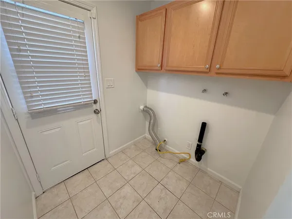 a view of a storage and utility room with closet