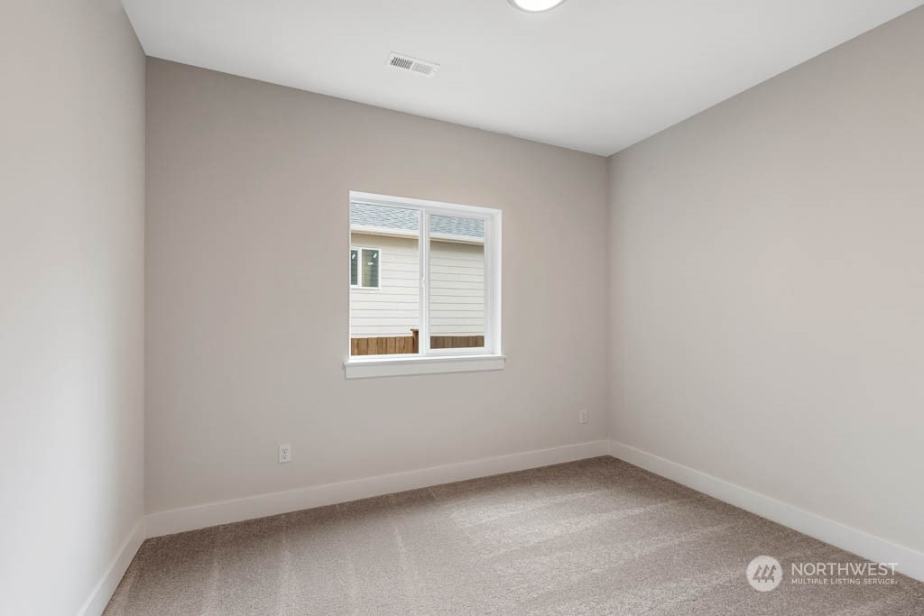 22921 20th Place West Bothell, WA 98021 - Photo 11 of 27 an empty room with a window