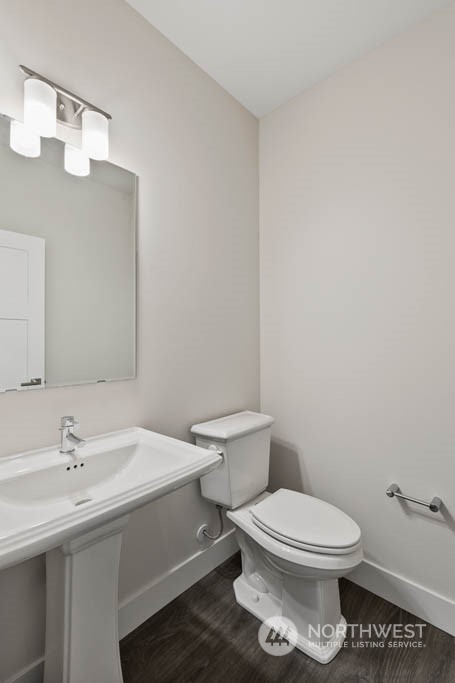 22921 20th Place West Bothell, WA 98021 - Photo 12 of 27 a bathroom with a toilet a sink and mirror