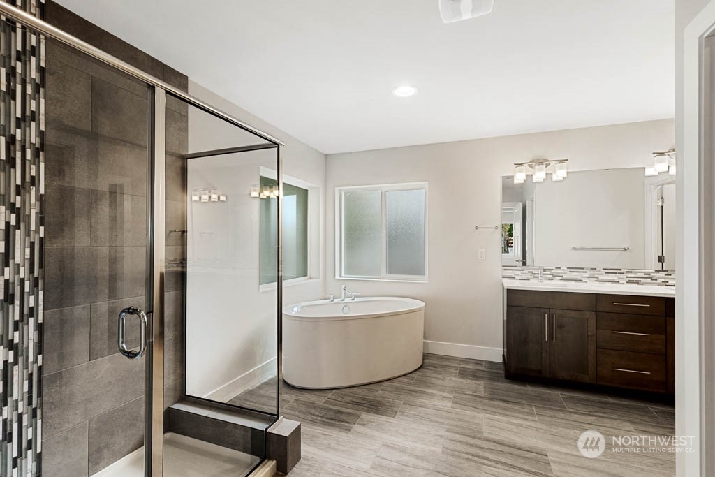 22921 20th Place West Bothell, WA 98021 - Photo 17 of 27 a bathroom with a tub sink shower and mirror