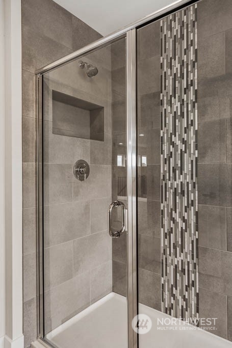 22921 20th Place West Bothell, WA 98021 - Photo 18 of 27 a bathroom with a shower and a bath tub